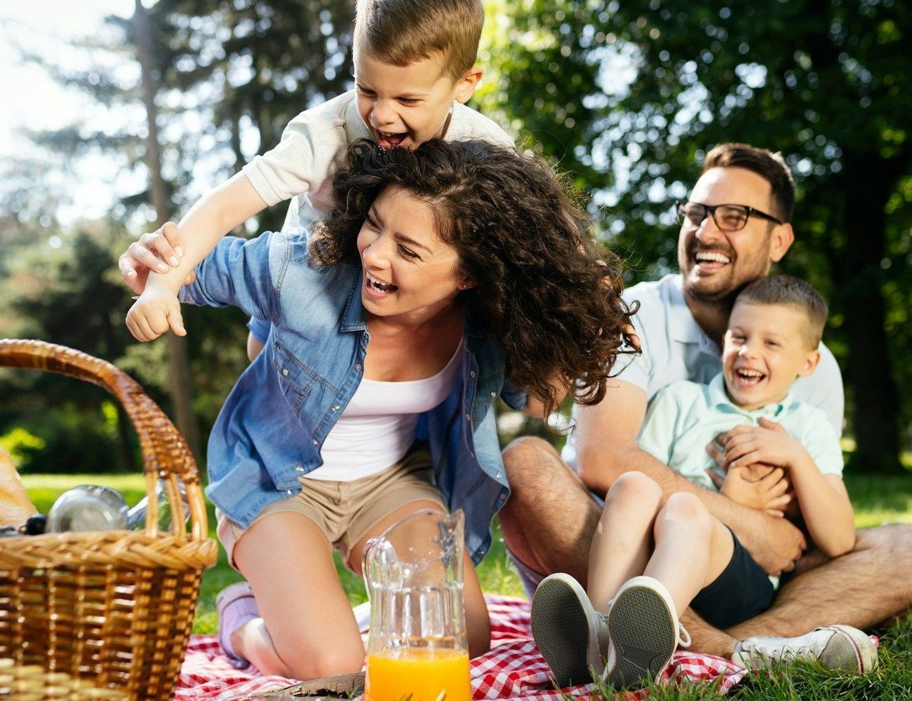 A family is having a picnic in the park.