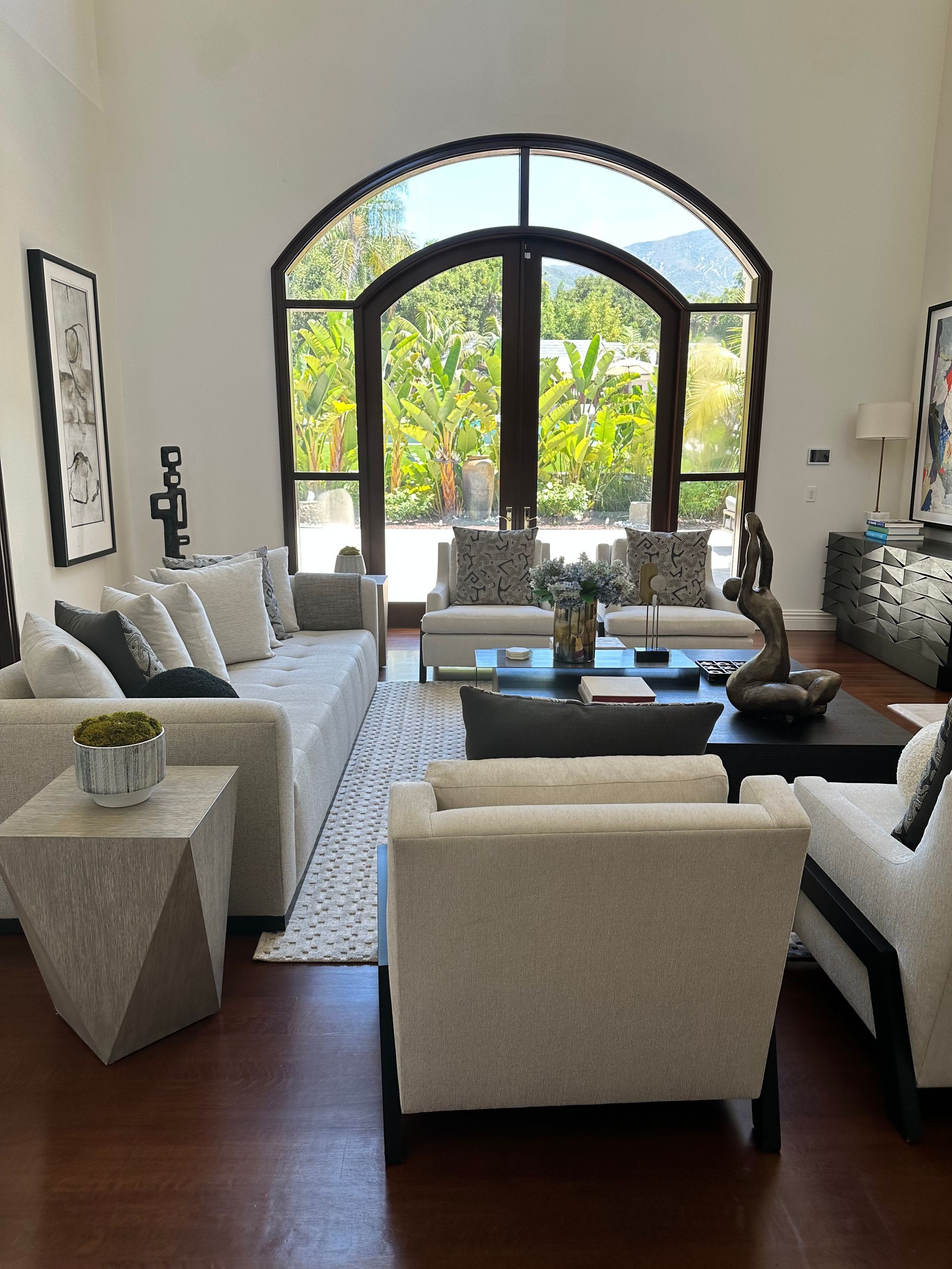 A living room filled with furniture and a large window
