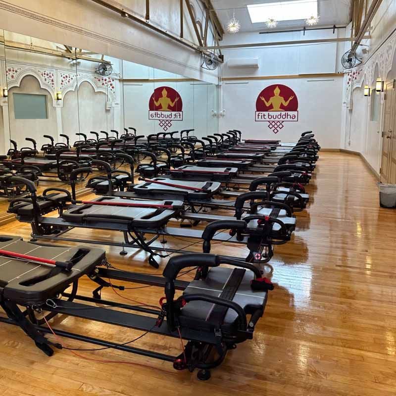 A large room filled with lots of exercise equipment.