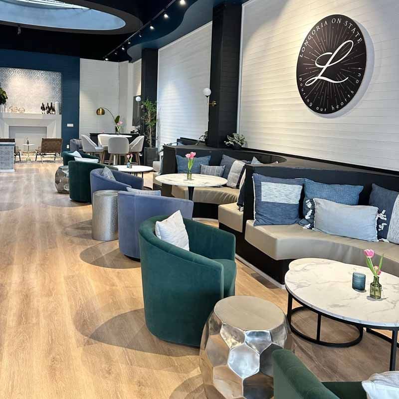 A restaurant with a large l on the wall