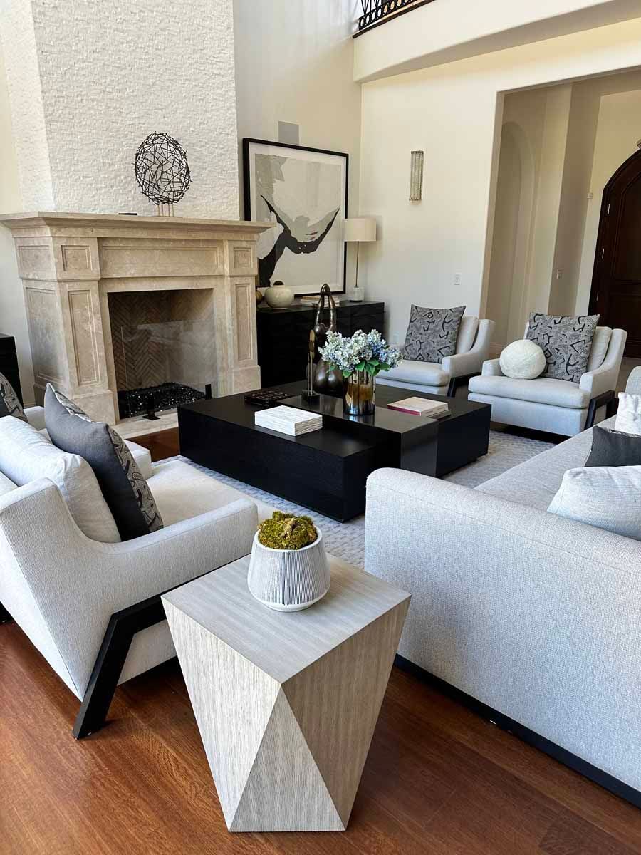 A living room filled with furniture and a fireplace.