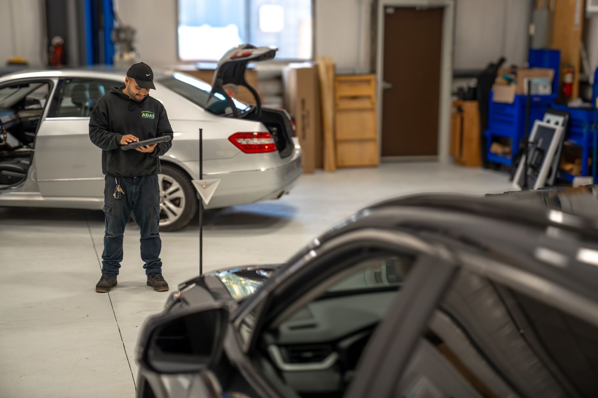 The interior of a car with red seats and a steering wheel