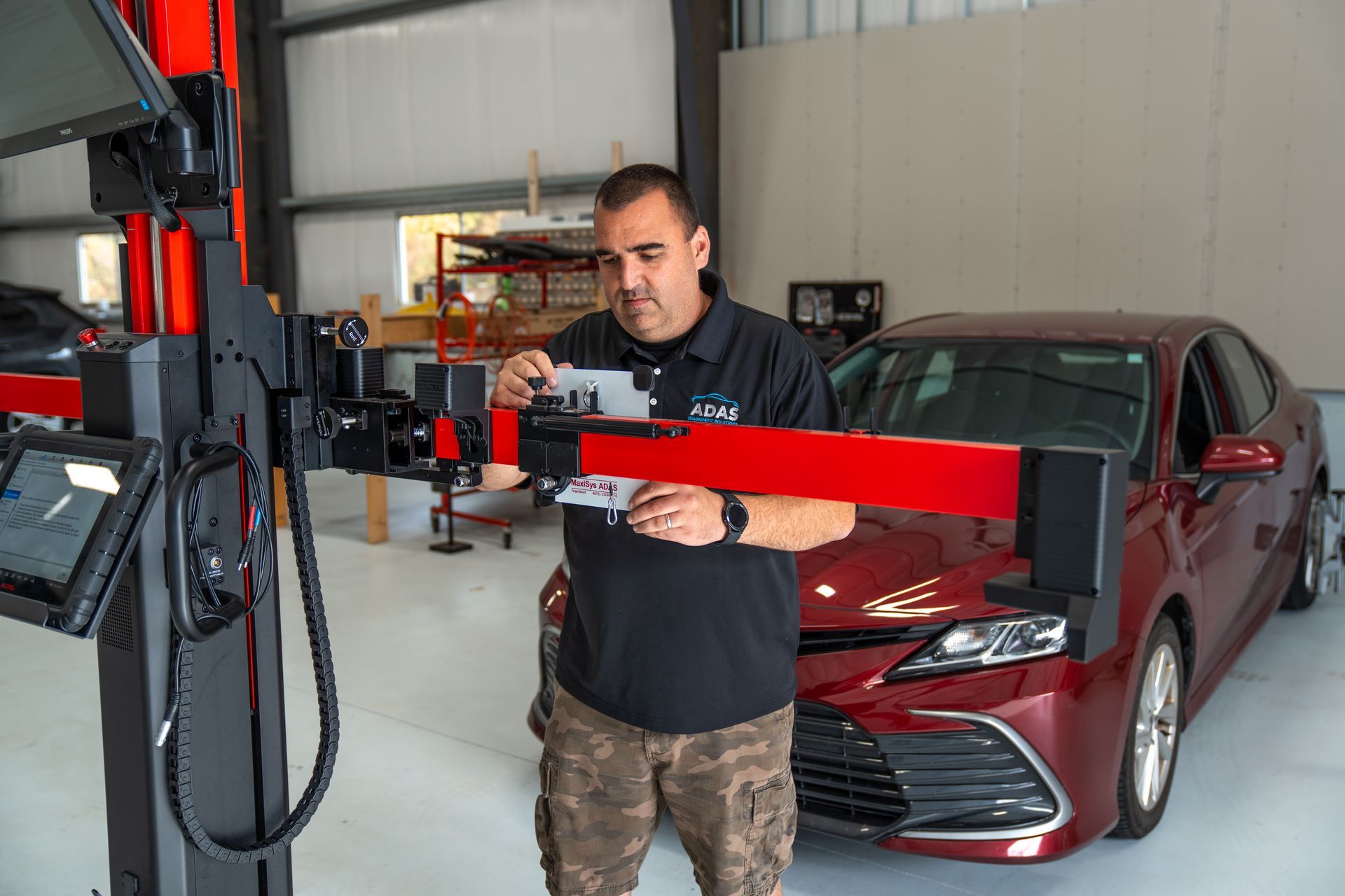A man and a woman are driving down a highway at night.