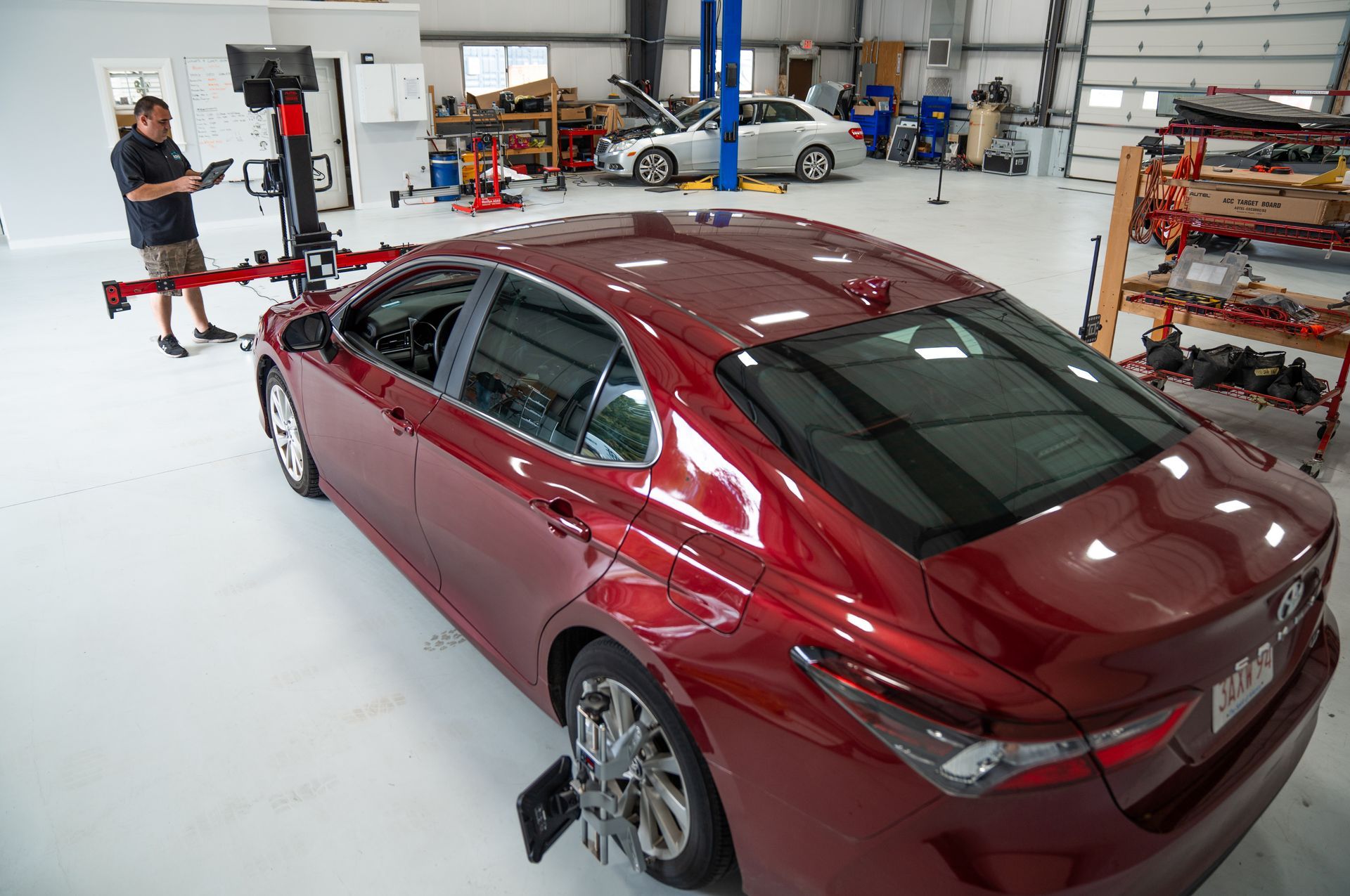A man and a woman are driving down a highway at night.