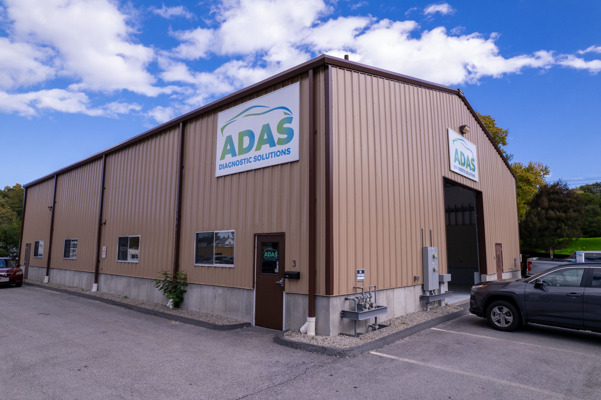 A man and a woman are driving down a highway at night.