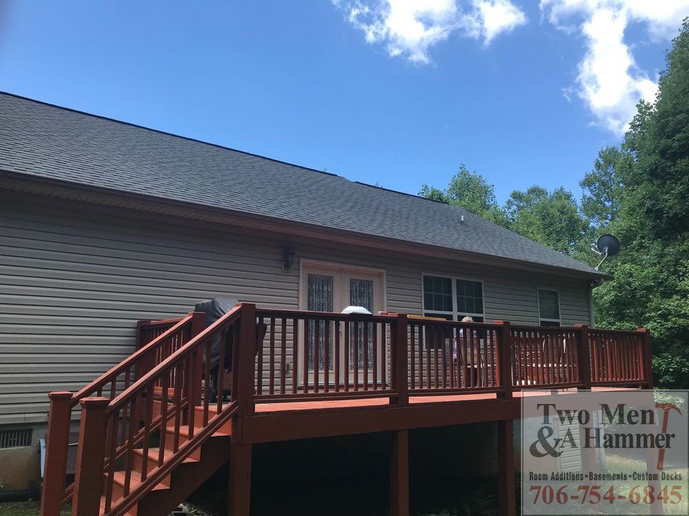 house exterior with new wooden patio