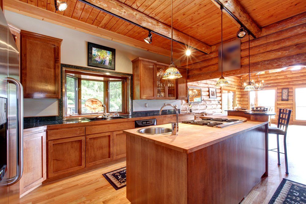 Log cabin large kitchen interior with island
