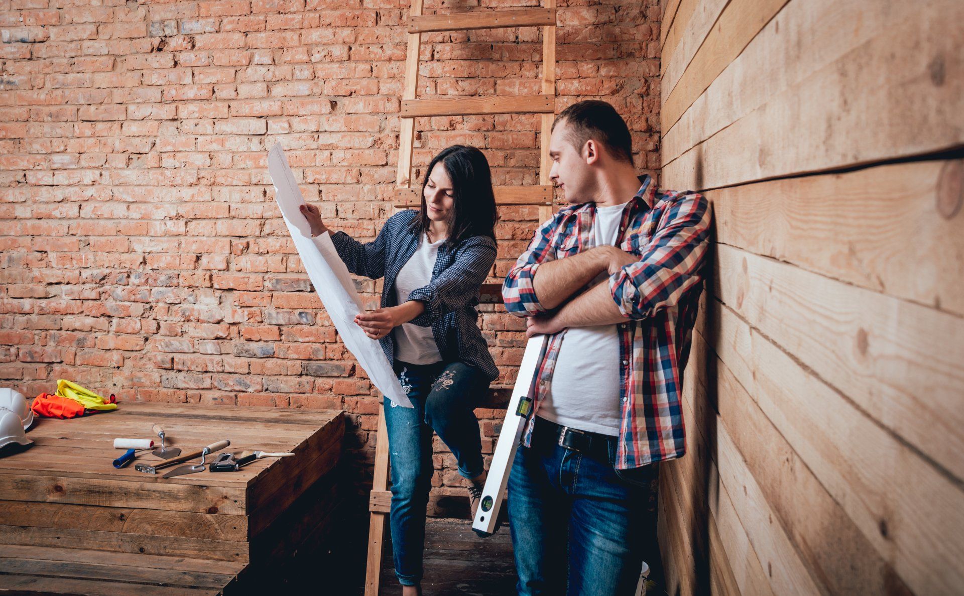 Man and woman looking at house plan