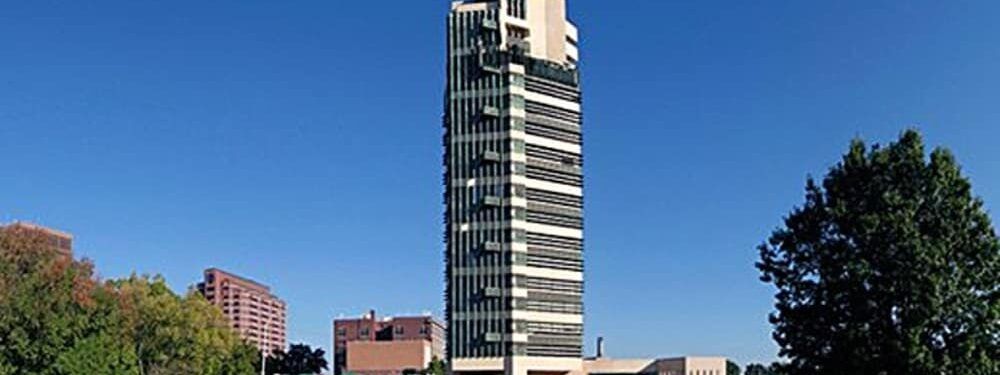 A tall building with a blue sky in the background