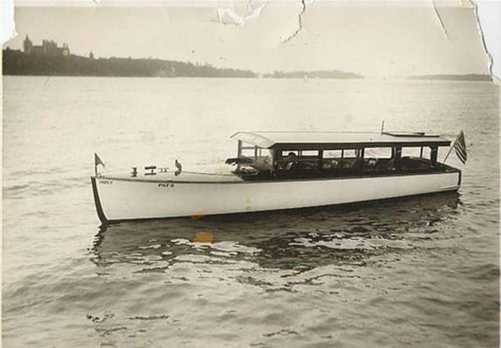 A black and white photo of a boat in the water.