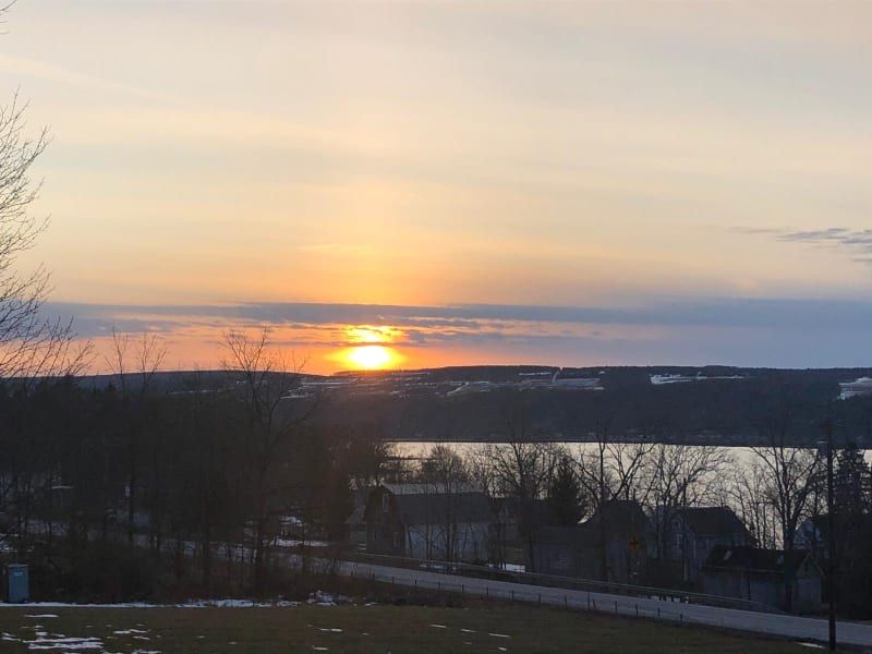 The sun is setting over a body of water