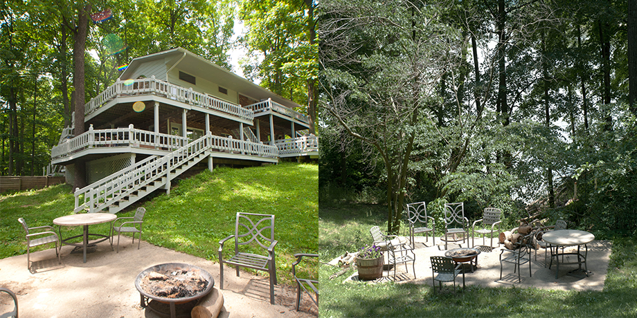 Wooded backyard with a raised cabin deck, stairs, picnic table, fire pit, and outdoor patio seating