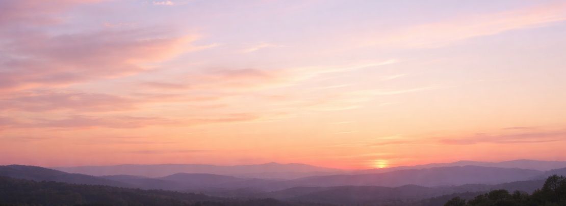 sky scene at dusk with soft pastel clouds spreading across a wide horizon in Martensville