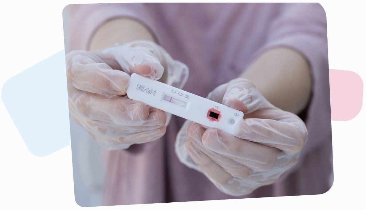 doctor with hands in protective gloves holding a negative covid test