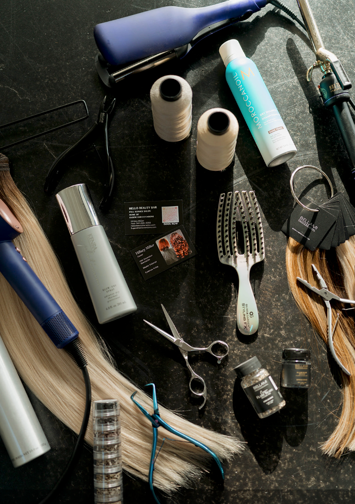 A bunch of hair products including hair straighteners and scissors