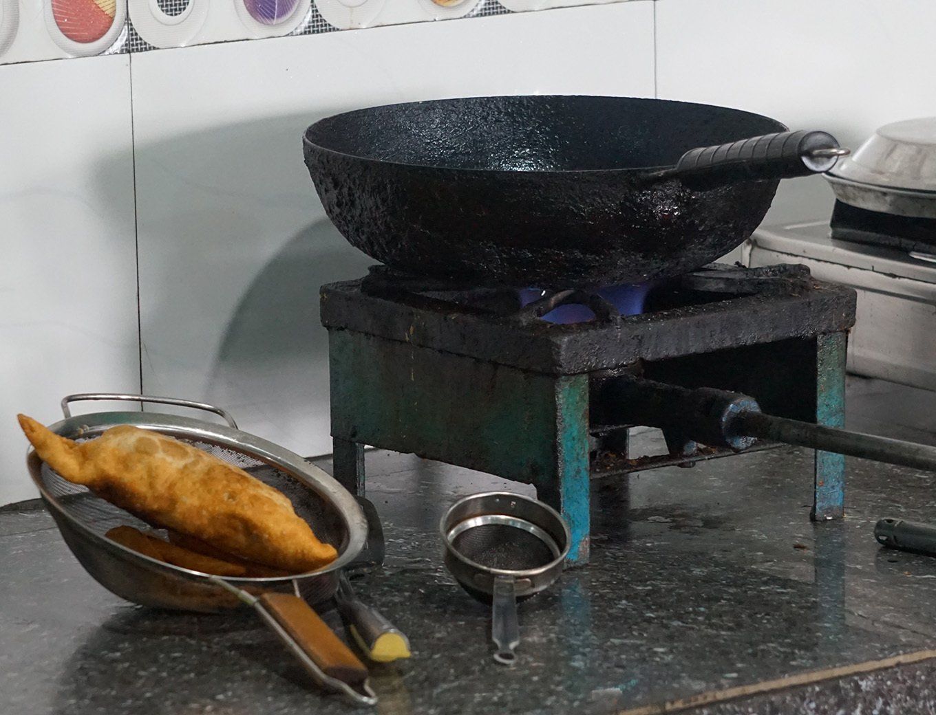 Essential cooking tools used in Nepali kitchens during the Annapurna Trek, illustrating local culinary practices.