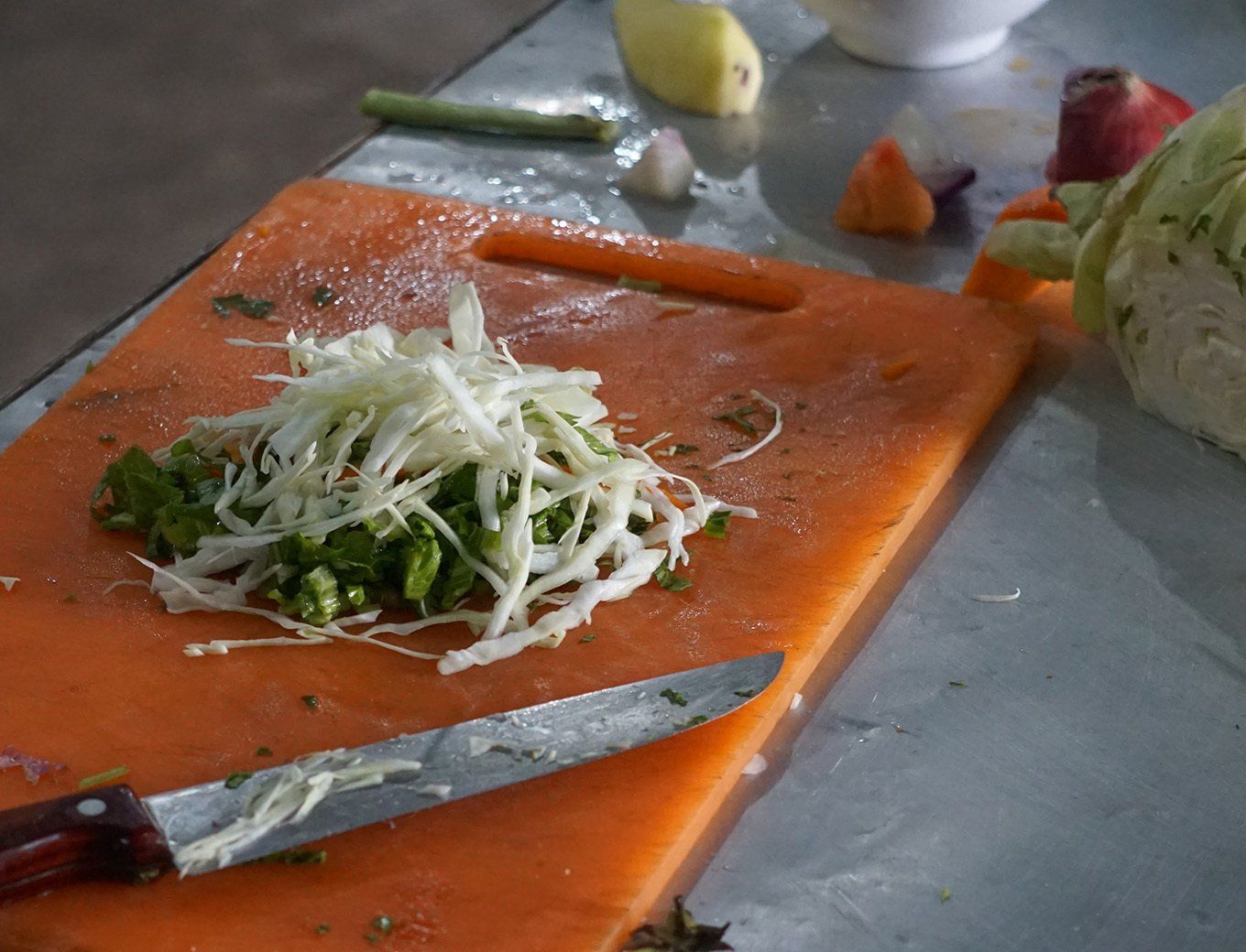 Fresh ingredients being prepared for a meal during trekking in Nepal, showcasing local cooking methods.