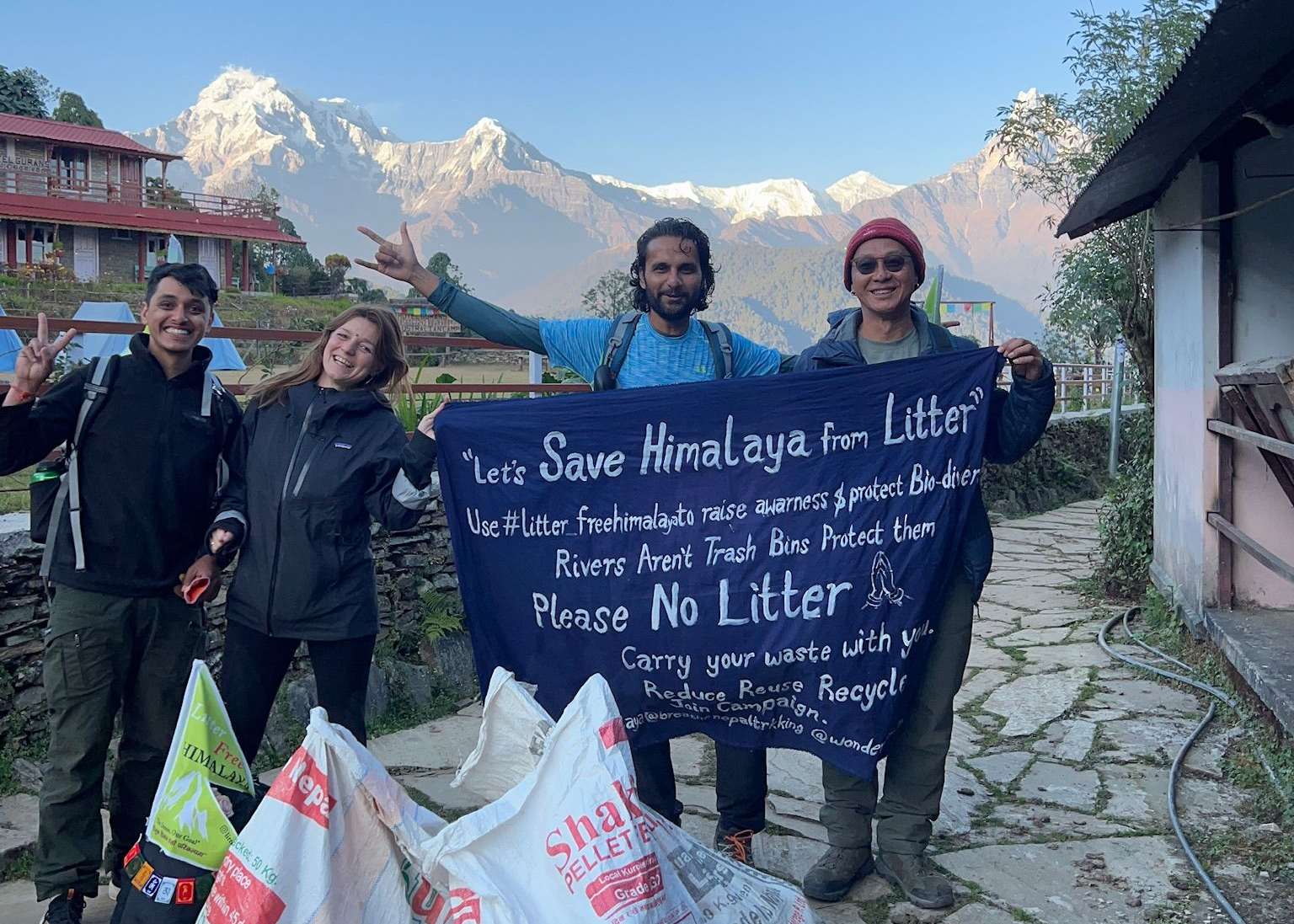 Litter Free Himalaya clean-up campaign on the trail with Annapurna range in the background, Nepal