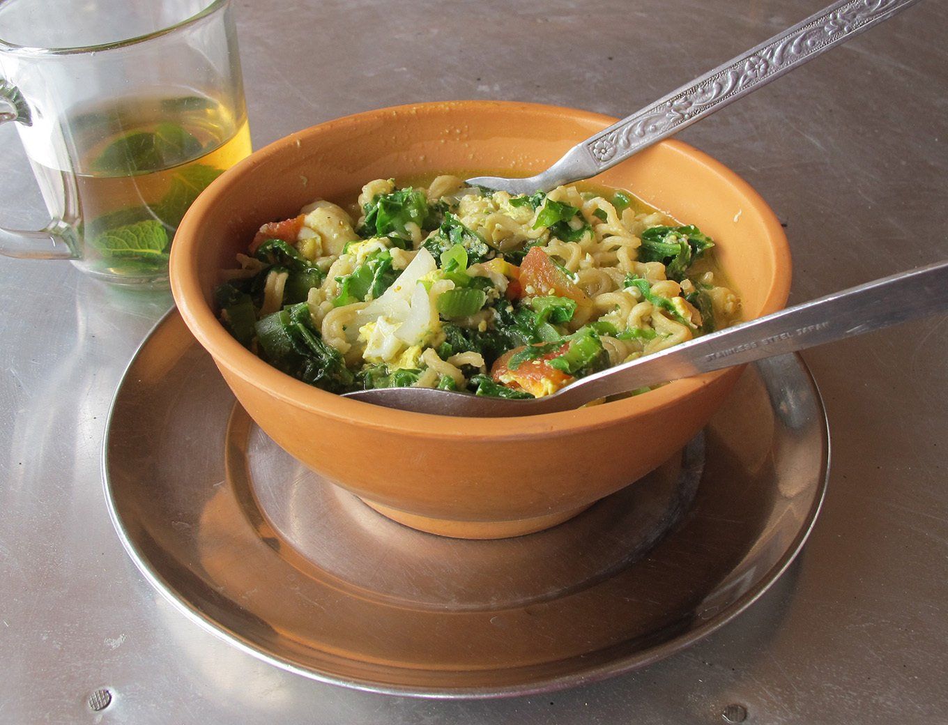 Hearty bowl of soup served during a trekking adventure in Nepal, ideal for restoring energy on the trail.