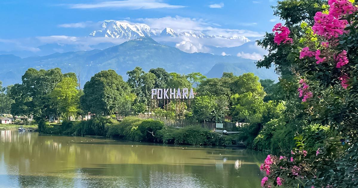 Phewa Lake in Pokhara wit snow covered mountain peaks in beackground