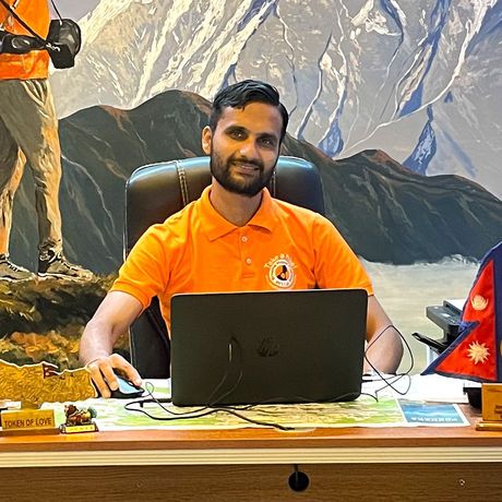 Local trekking guide in Nepal in his office in Pokhara