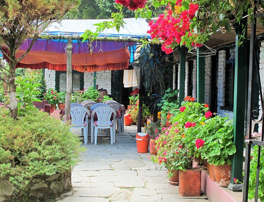 Beautiful garden dining area in a colorful guesthouse along the Annapurna Trek in Nepal