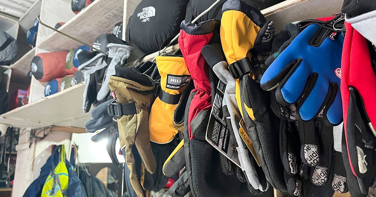 A variety of trekking gloves hanging in a shop in Pokhara, Nepal.