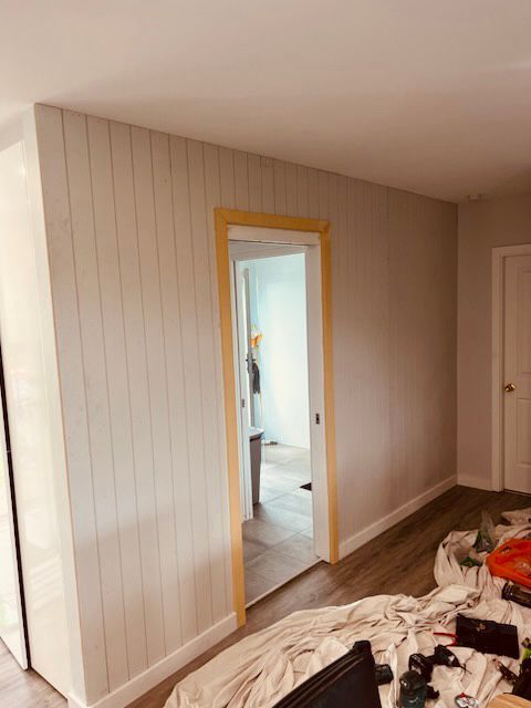 Interior Room With Light Gray Planked Wall, Doorway, and Wooden Trim — Kalora Carpentry & Restorations in Charlestown, NSW