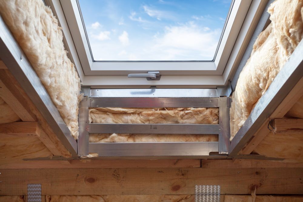 Skylight Installed in a Wooden Roof, With Insulation Visible Around the Frame — Kalora Carpentry & Restorations in Charlestown, NSW