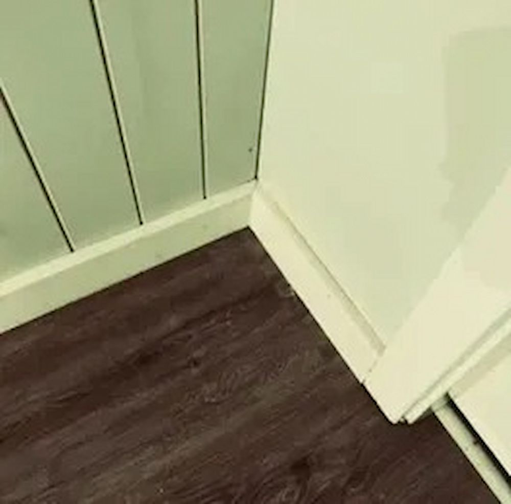 Dark Brown Wood-look Floor Meets a Corner — Kalora Carpentry & Restorations in New Lambton, NSW