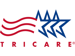 TRICARE logo with red and blue elements: waving lines and three blue stars.