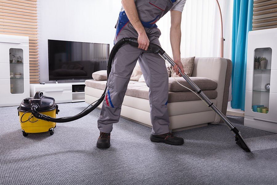 worker cleaning the floor carpet