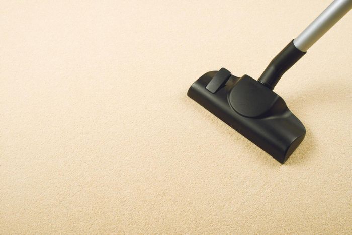 black vacuum in the carpet