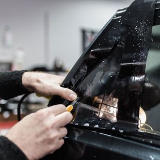 Automotive Tinting — Cutting A Tint Film in Glen Burnie, MD