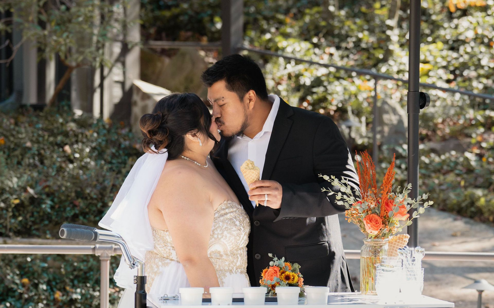 A couple kissing at a wedding A couple kissing at a wedding