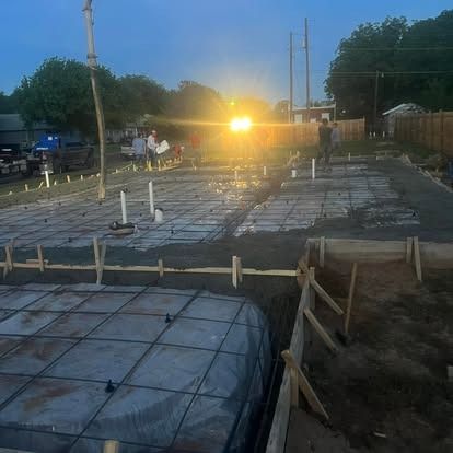 A construction site with a lot of concrete being poured.