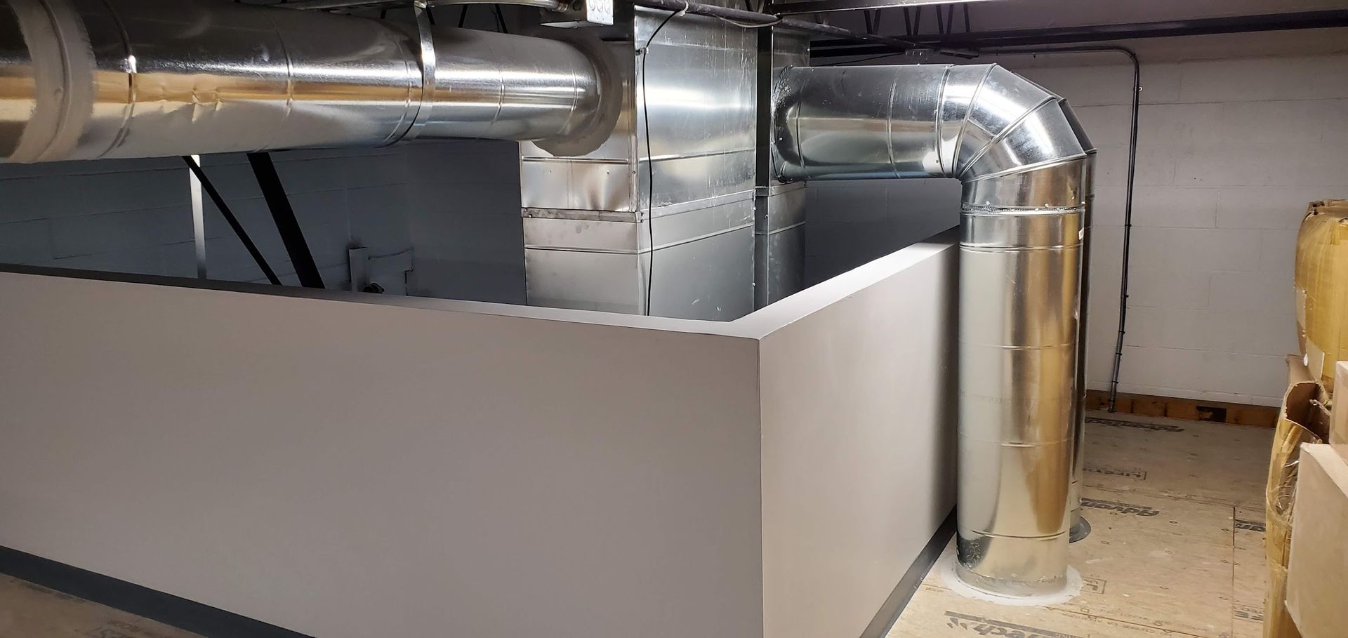 A room with a lot of pipes coming out of it.