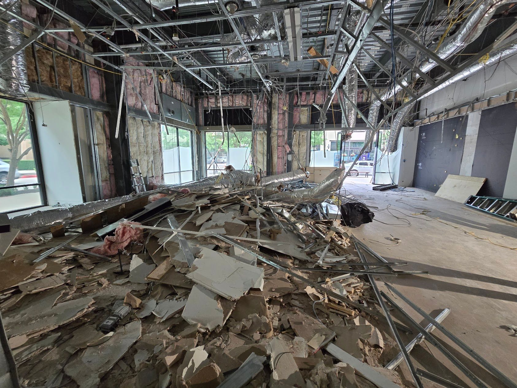 There is a lot of rubble in the middle of the room.