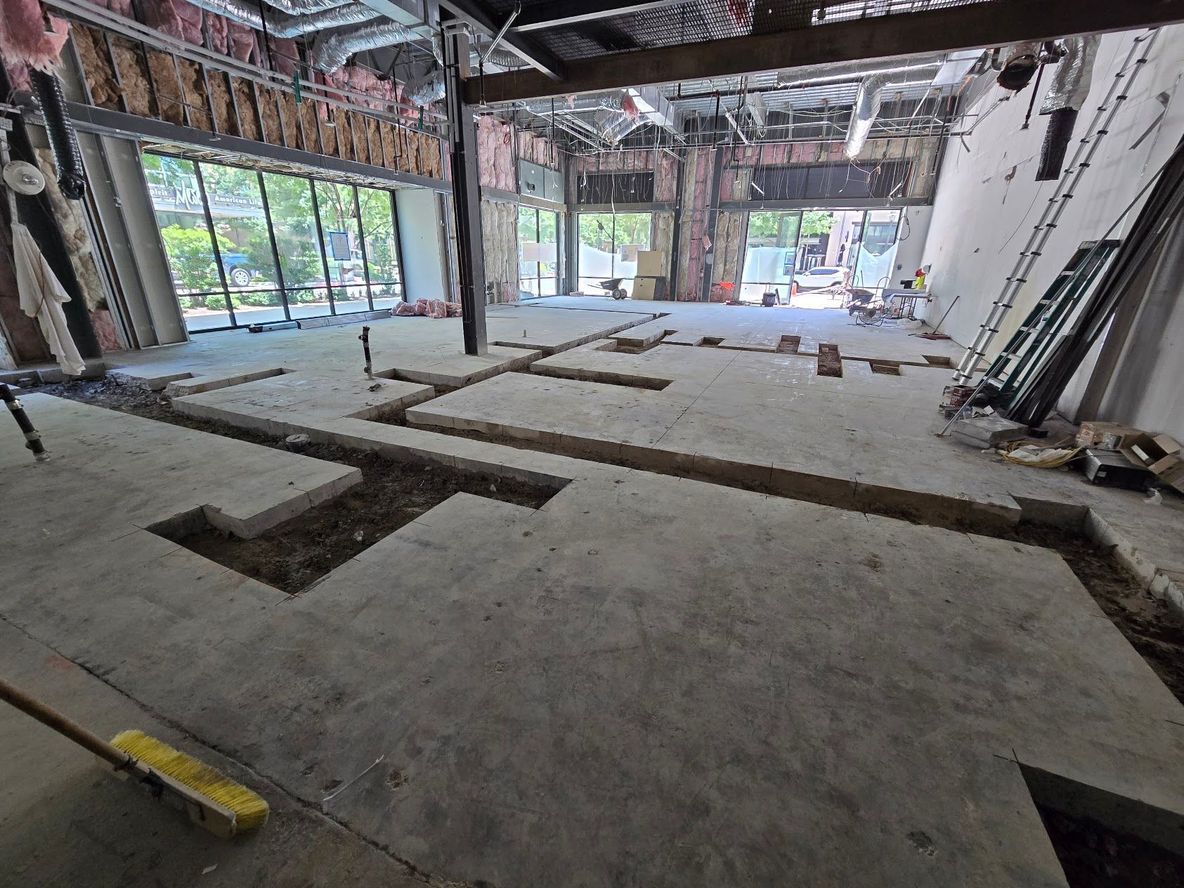 A large empty building under construction with a lot of windows.