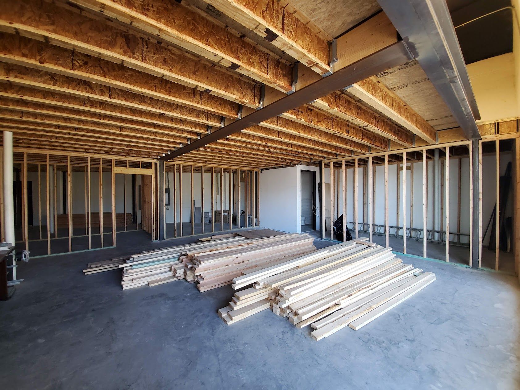 A room under construction with a lot of wood in it.