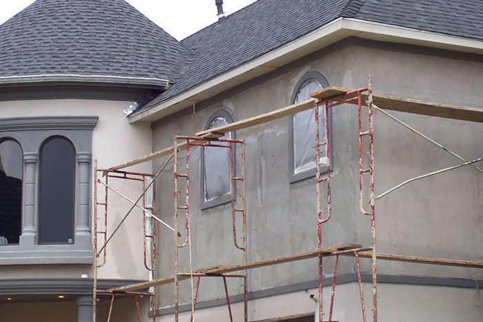 A house is under construction with scaffolding around it