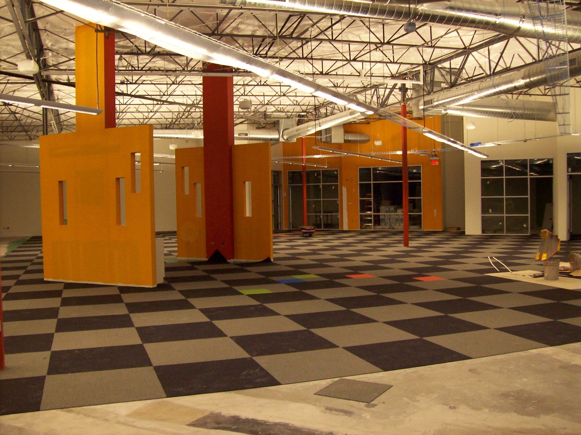 A large empty room with a checkered floor