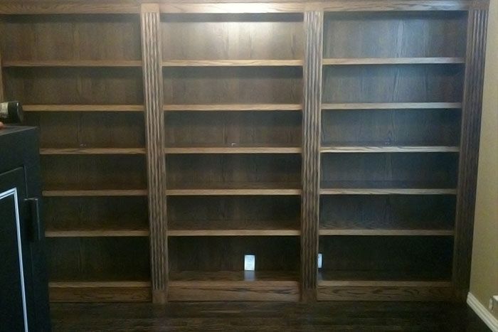 A row of wooden shelves in a room