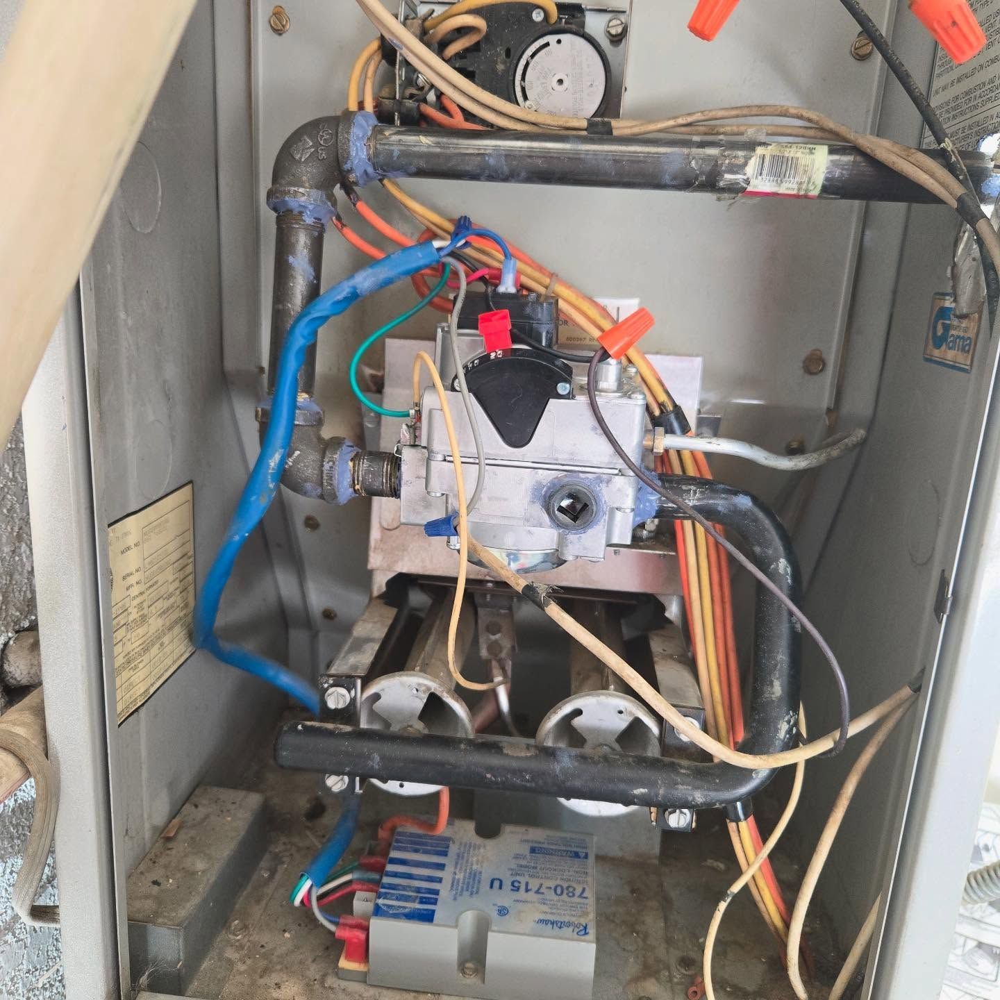 The inside of a box with wires and a label that says ' a ' on it