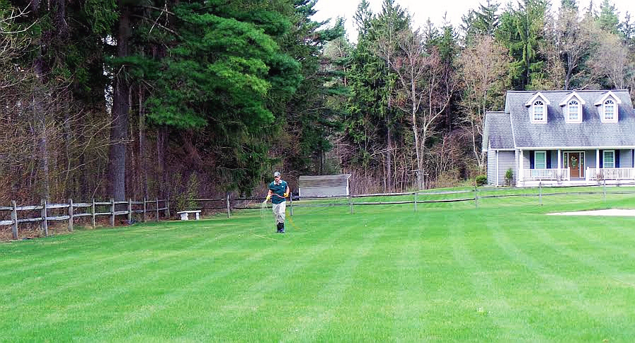 Lawn Care Programs — Lawn Aerator On Grass in Twin Falls, ID