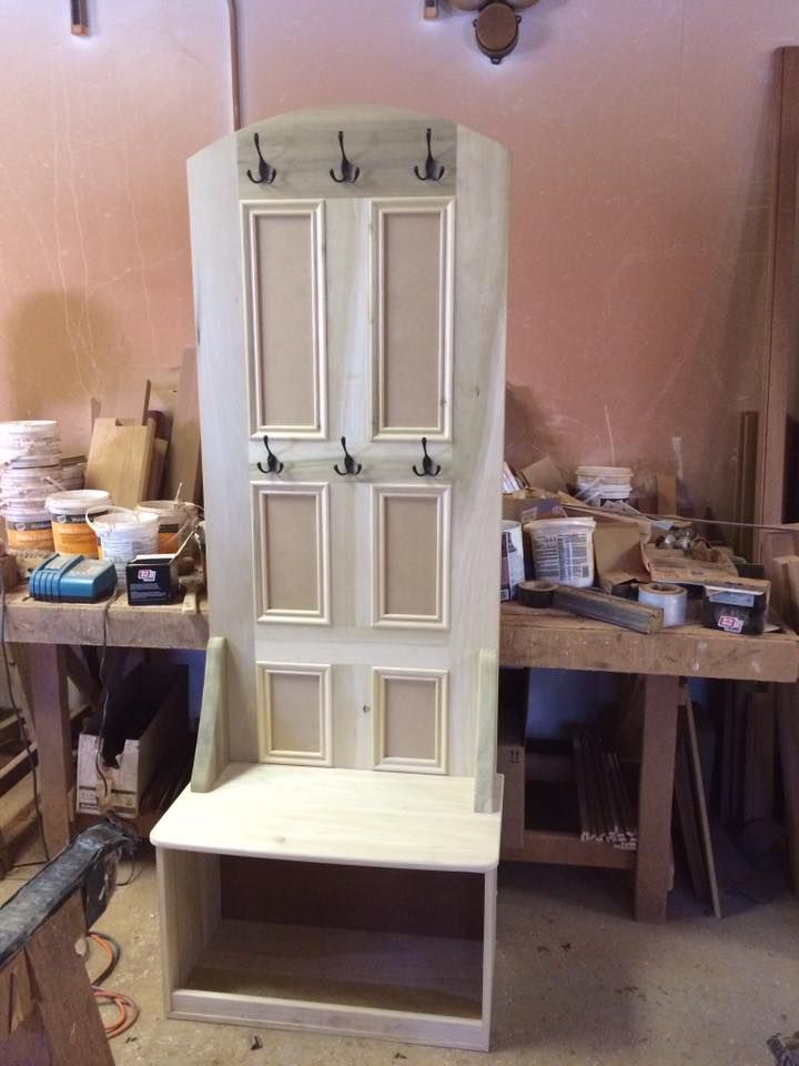 A hallway with stairs leading up to the second floor of a house.