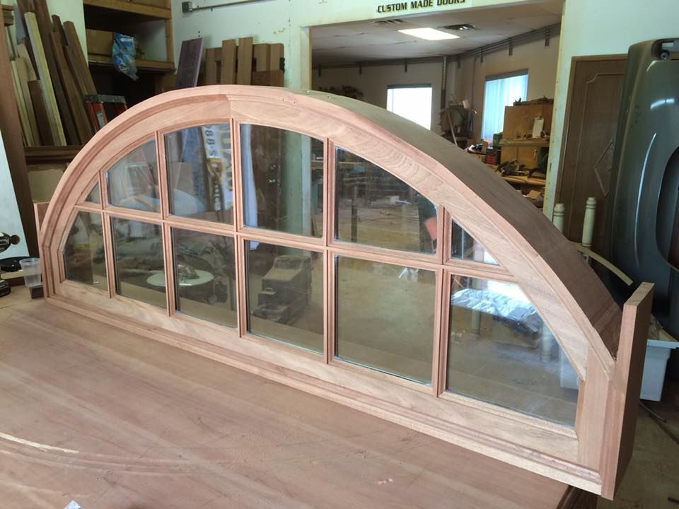 A wooden door with an open sign on it.