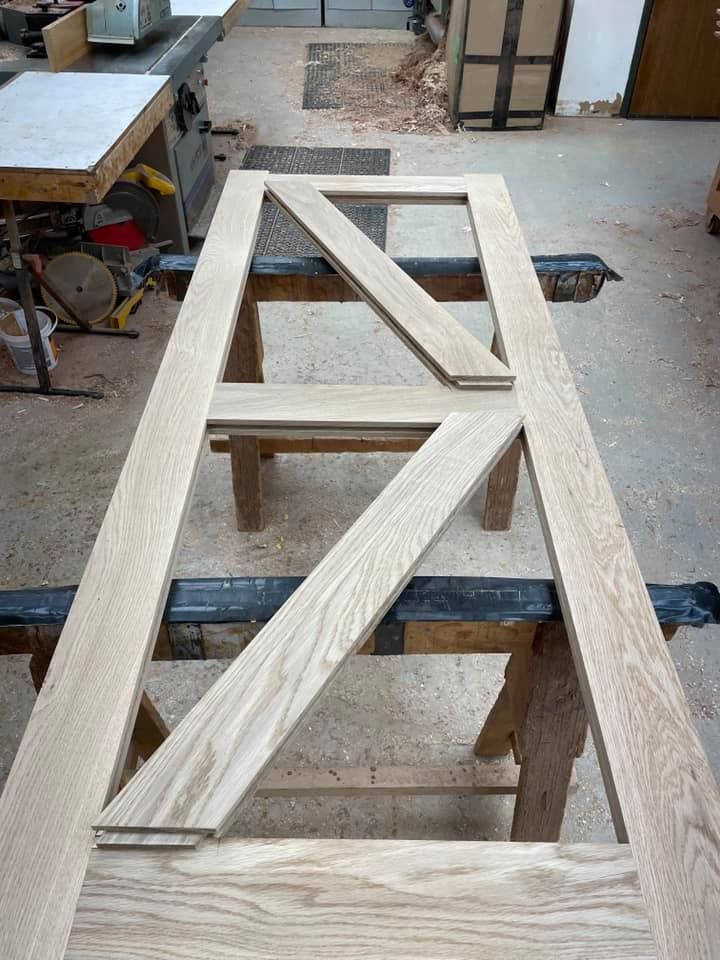 A piece of wood is sitting on top of a wooden table.