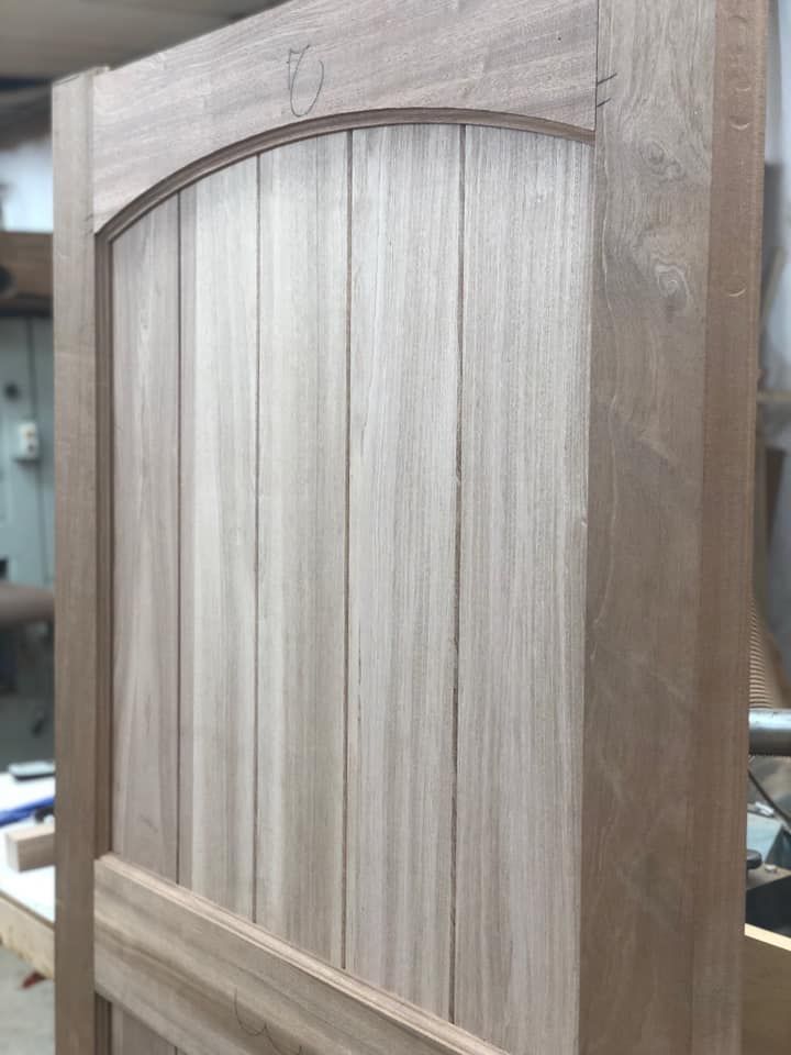 A close up of a wooden door in a workshop.