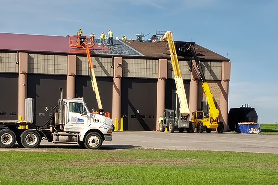 Image of Fire Station Roofing Project in Minot, North Dakota. A fire station at Minot Air Force Base in Minot, North Dakota features a fully- adhered Sarnafil Deco-Rib PVC Roof System.